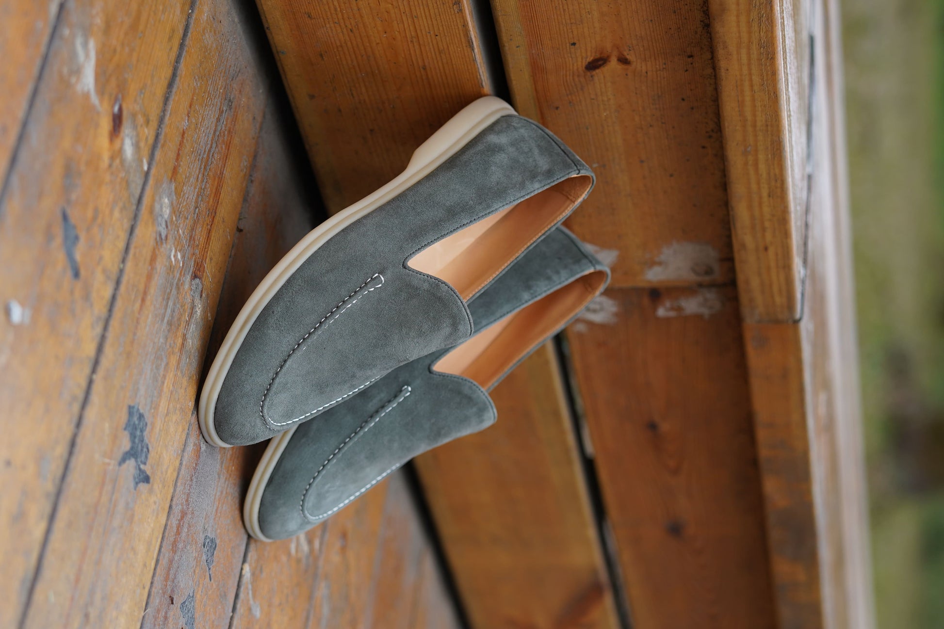 Men’s grey suede leather casual slip-on loafers with moccasin stitching and lightweight sole.