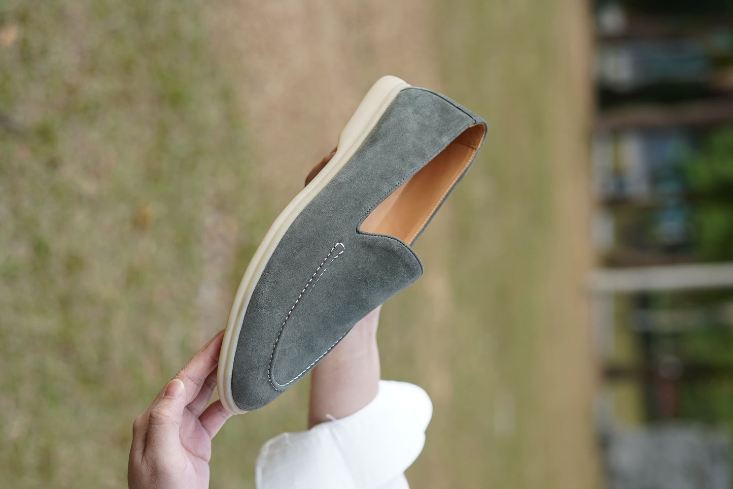 Men’s grey suede leather casual slip-on loafers with moccasin stitching and lightweight sole.