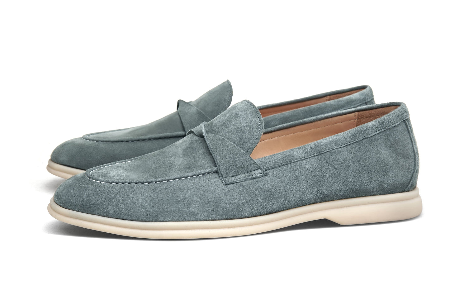 Men’s grey suede leather penny loafers featuring classic vamp strap detail and lightweight cream sole.