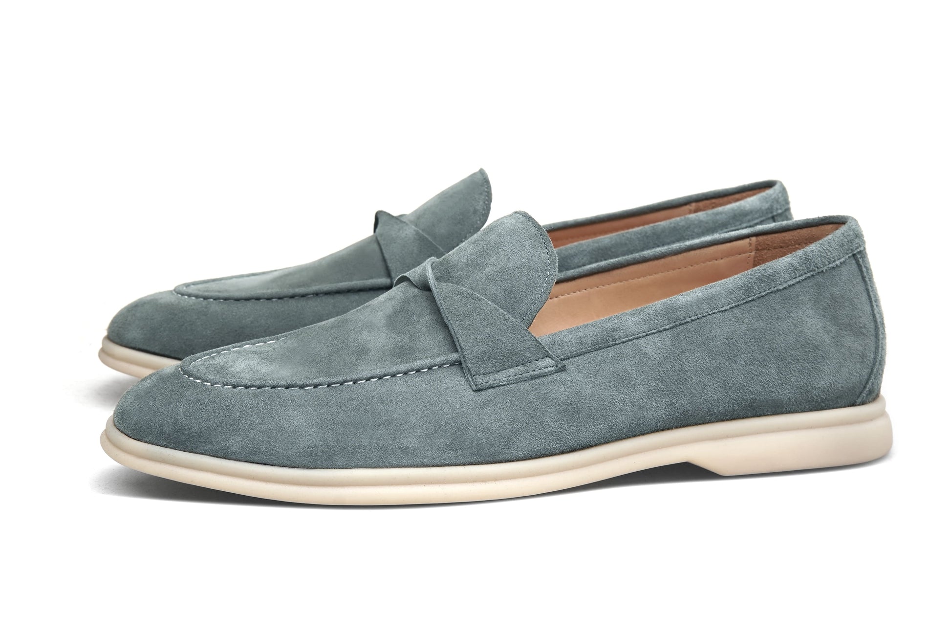 Men’s grey suede leather penny loafers featuring classic vamp strap detail and lightweight cream sole.