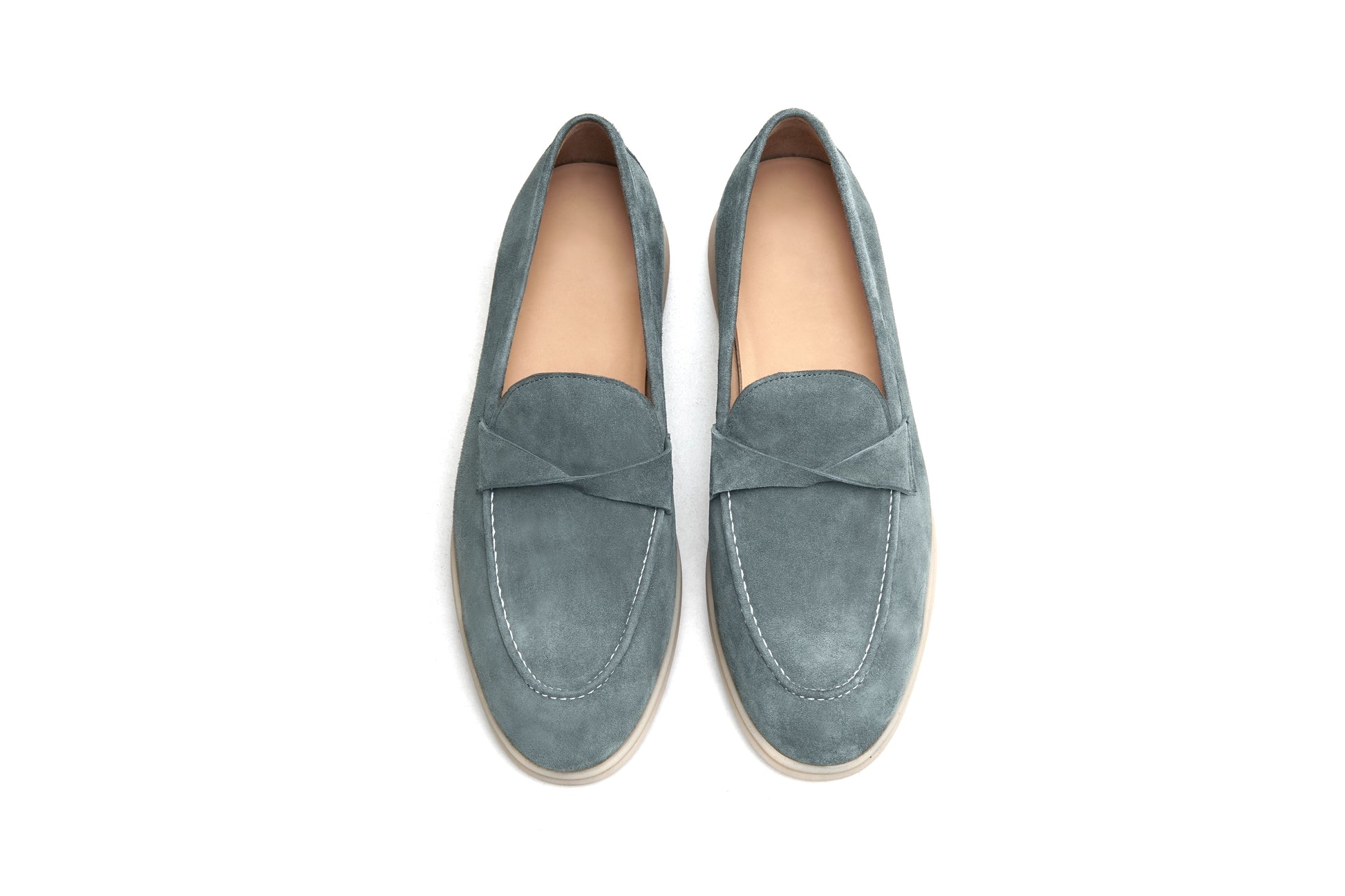 Men’s grey suede leather penny loafers featuring classic vamp strap detail and lightweight cream sole.