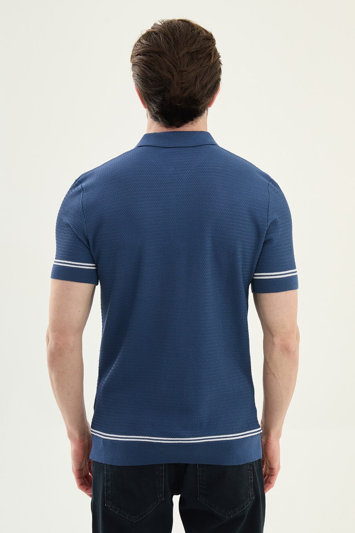 Male model wearing an indigo slim-fit quarter-zip polo T-shirt with short sleeves, styled for summer smart-casual outfits.