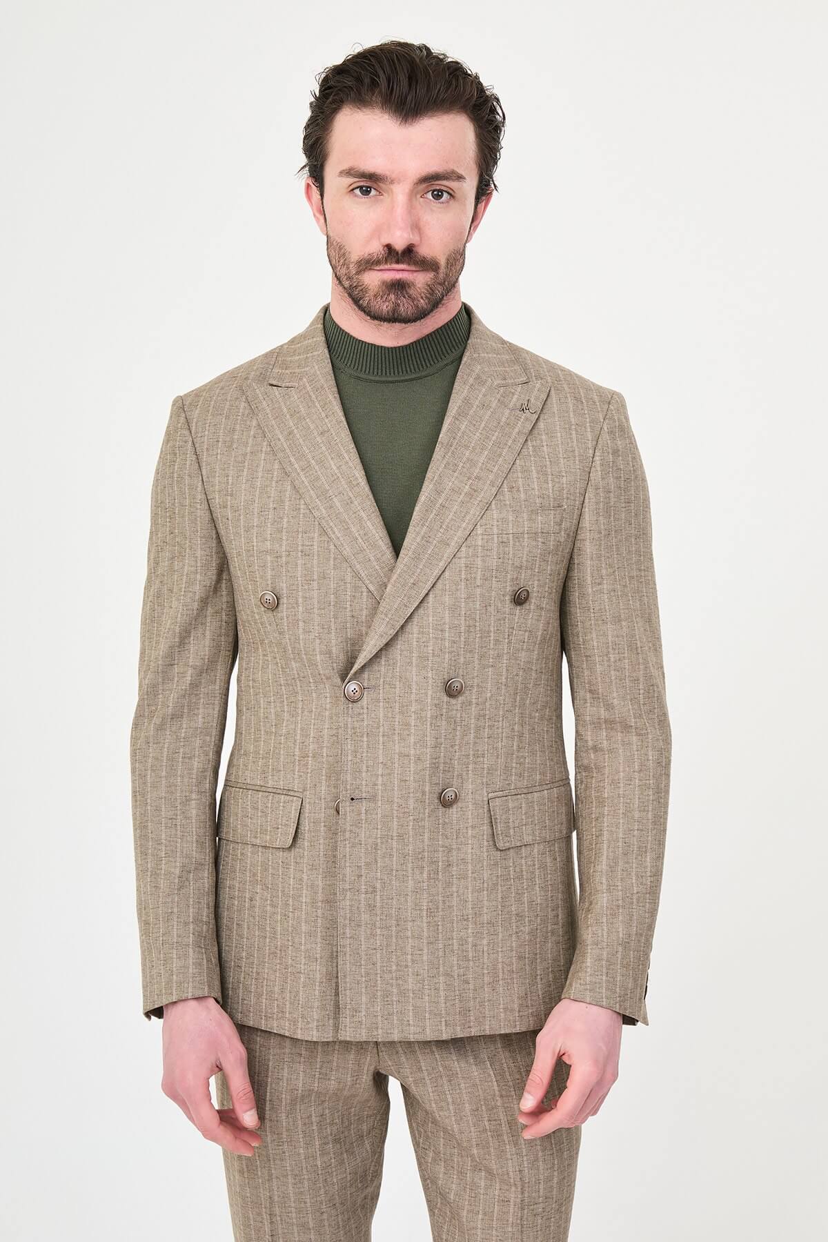 Men wearing a khaki pinstripe double-breasted slim-fit suit from the summer collection, styled with dress shoes and a green turtleneck
