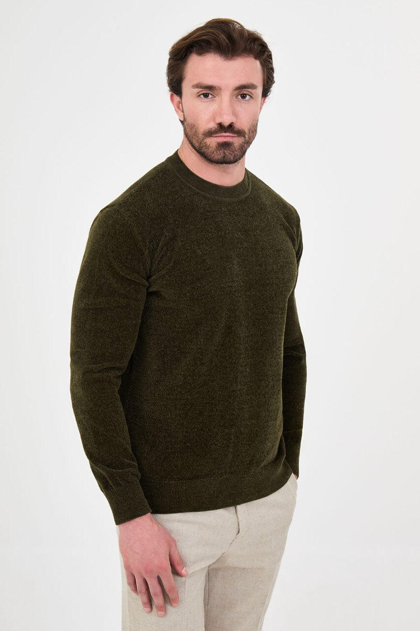 Men’s khaki crew neck knit sweater in a cotton blend slim fit design styled with neutral trousers for a refined fall winter outfit.