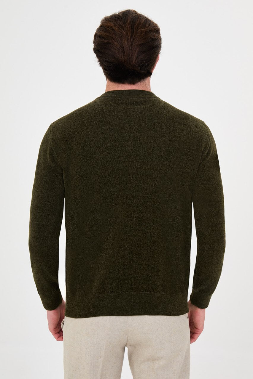 Men’s khaki crew neck knit sweater in a cotton blend slim fit design styled with neutral trousers for a refined fall winter outfit.