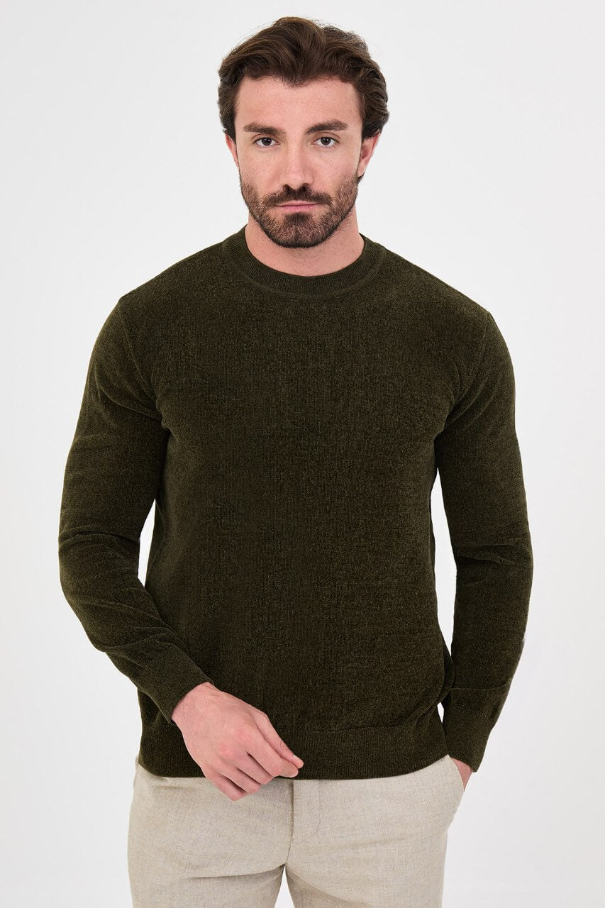 Men’s khaki crew neck knit sweater in a cotton blend slim fit design styled with neutral trousers for a refined fall winter outfit.