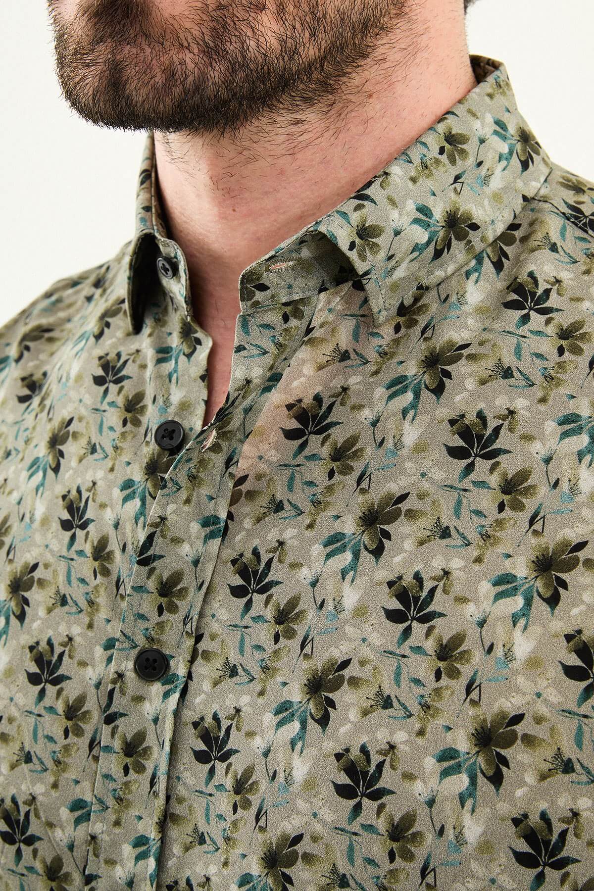 Khaki long-sleeve men’s shirt with floral pattern, slim fit, modeled front view, summer collection.