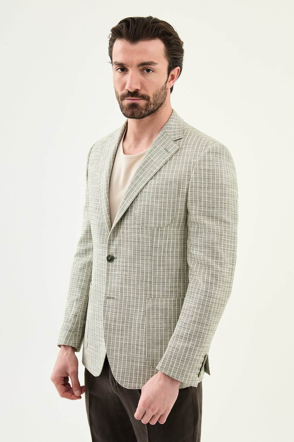 Men’s khaki slim fit cotton linen blazer with a lightweight textured finish, styled for smart casual and formal summer occasions.