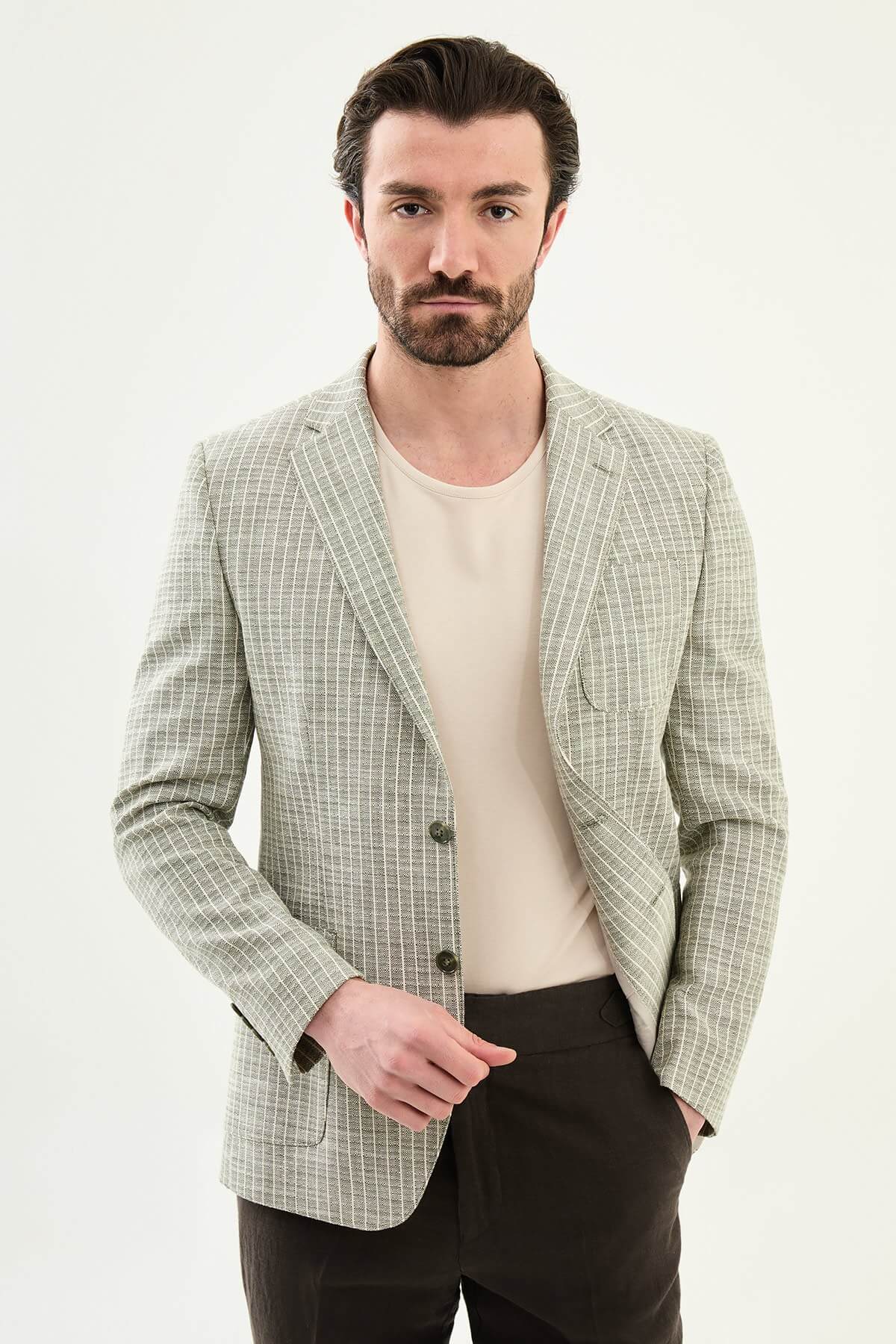 Men’s khaki slim fit cotton linen blazer with a lightweight textured finish, styled for smart casual and formal summer occasions.
