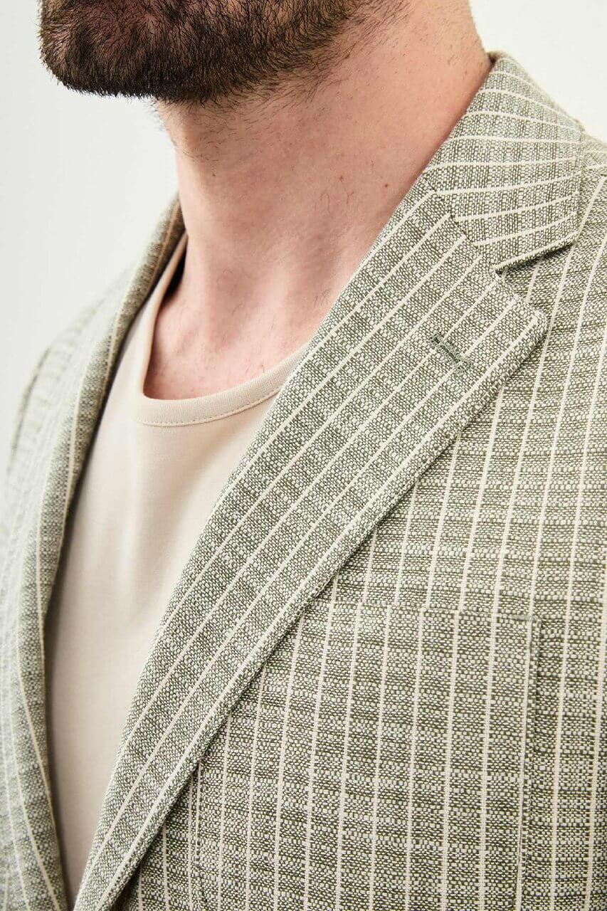 Men’s khaki slim fit cotton linen blazer with a lightweight textured finish, styled for smart casual and formal summer occasions.