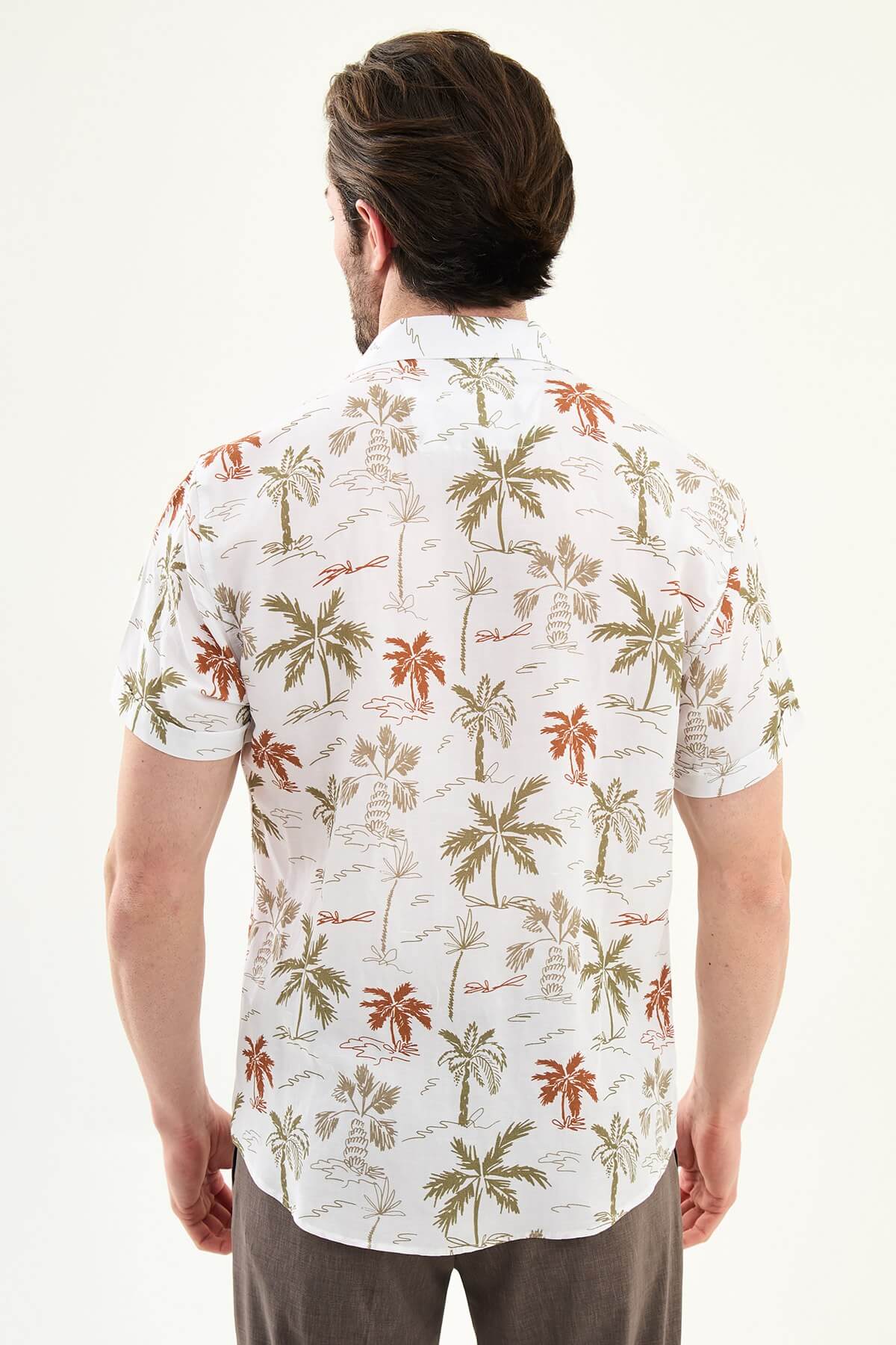 Men’s khaki palm tree print short sleeve shirt made from a lightweight Tencel and linen blend, styled for summer vacations and resort wear.
