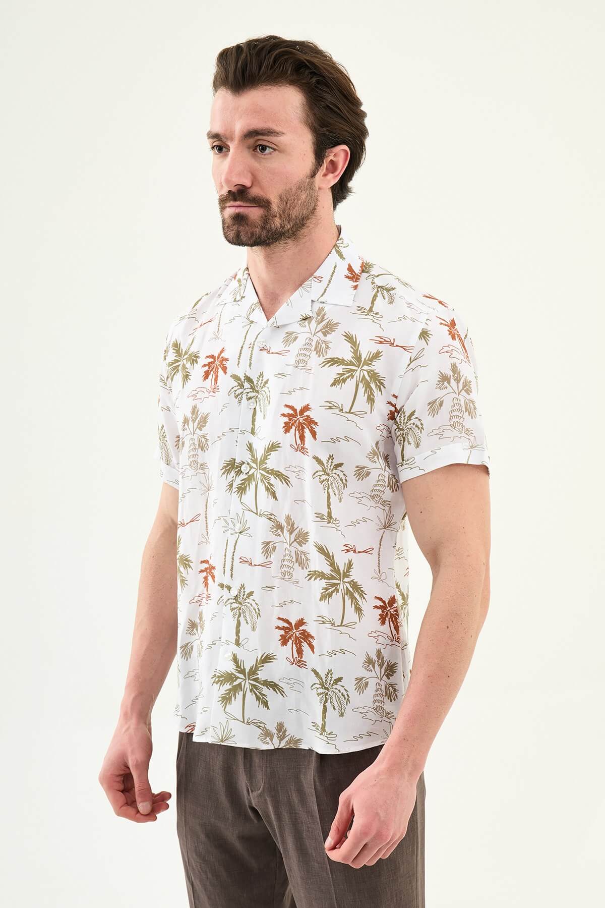 Men’s khaki palm tree print short sleeve shirt made from a lightweight Tencel and linen blend, styled for summer vacations and resort wear.