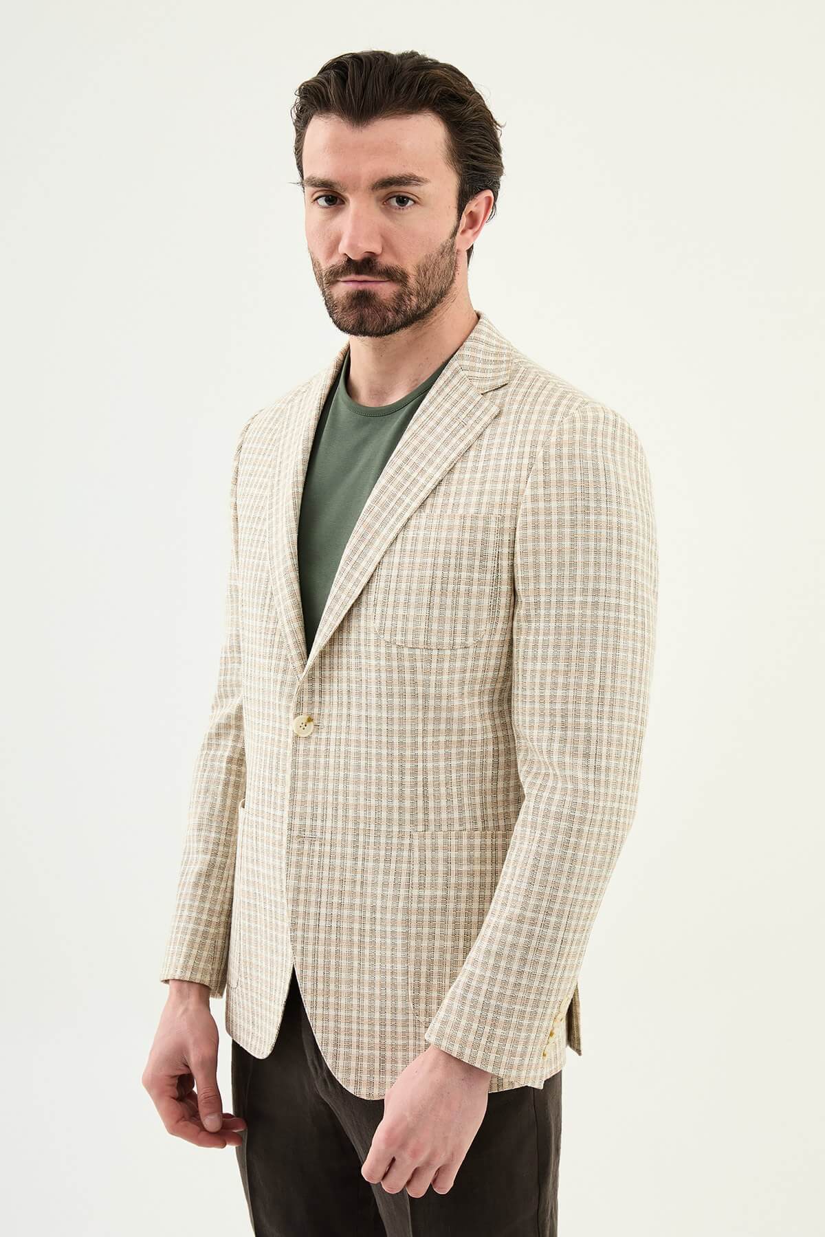 Men’s khaki slim fit cotton linen blazer with a lightweight textured pattern, styled for smart casual and elegant summer occasions.