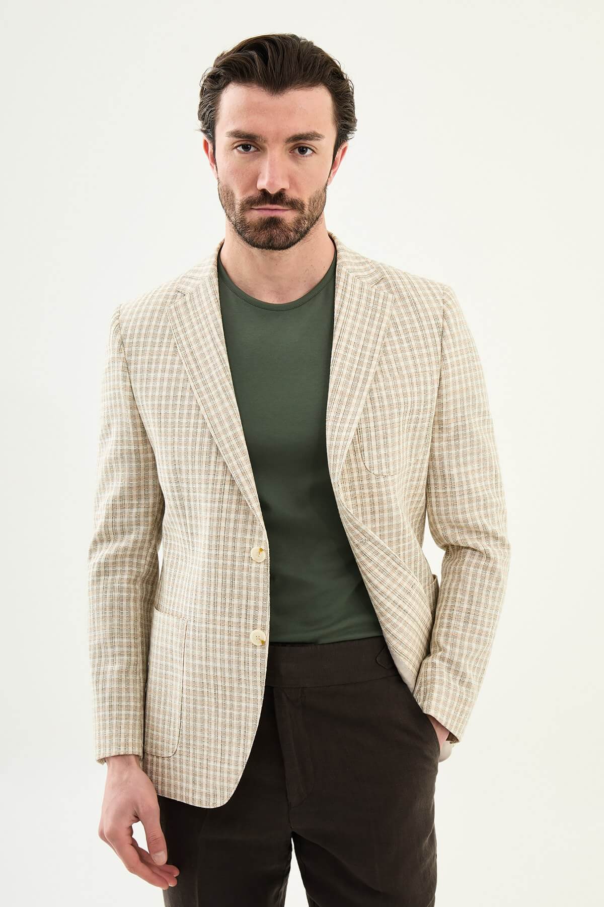 Men’s khaki slim fit cotton linen blazer with a lightweight textured pattern, styled for smart casual and elegant summer occasions.