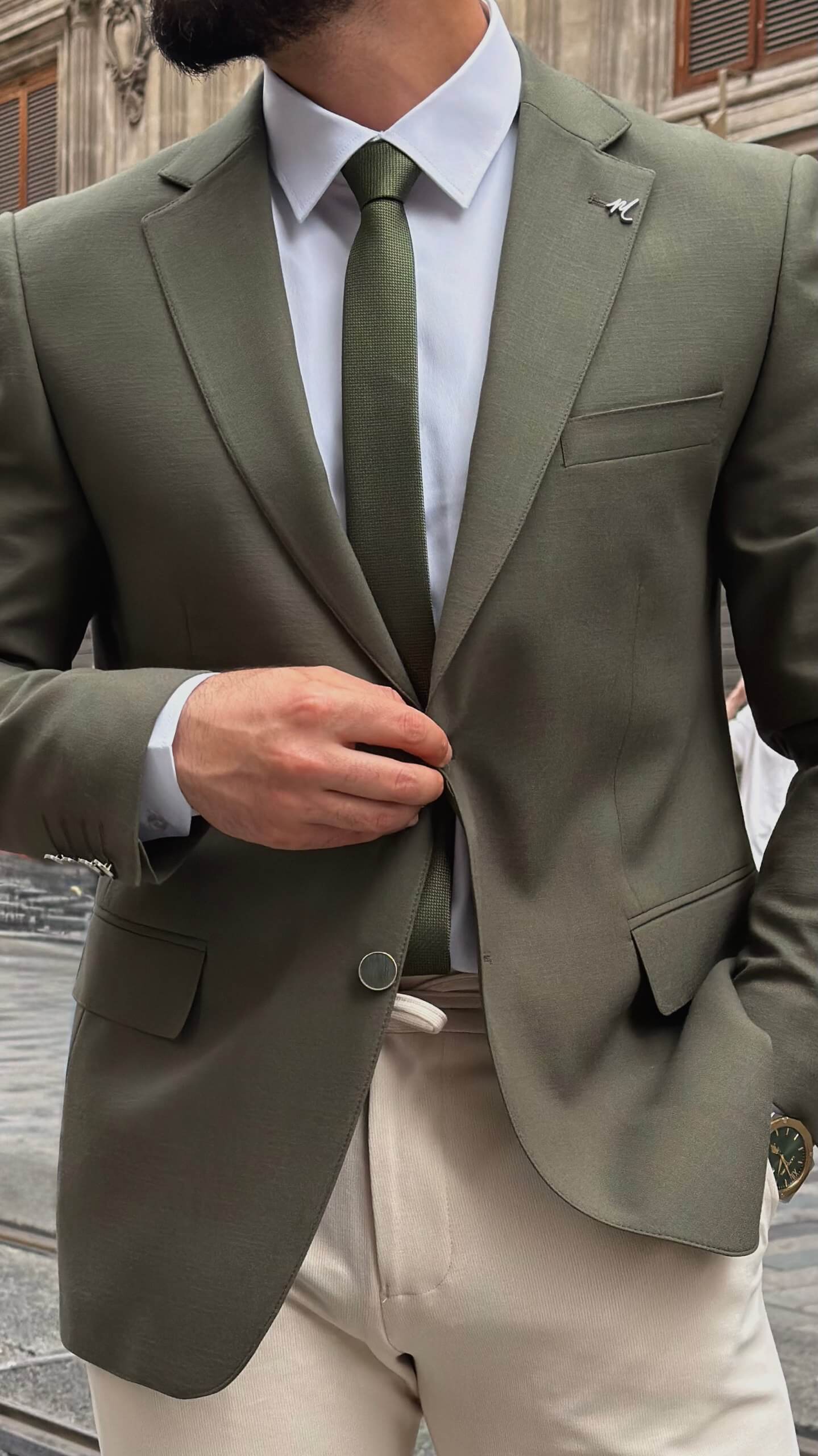 khaki textured blazer and matching trousers, styled with a white shirt and khaki shoes