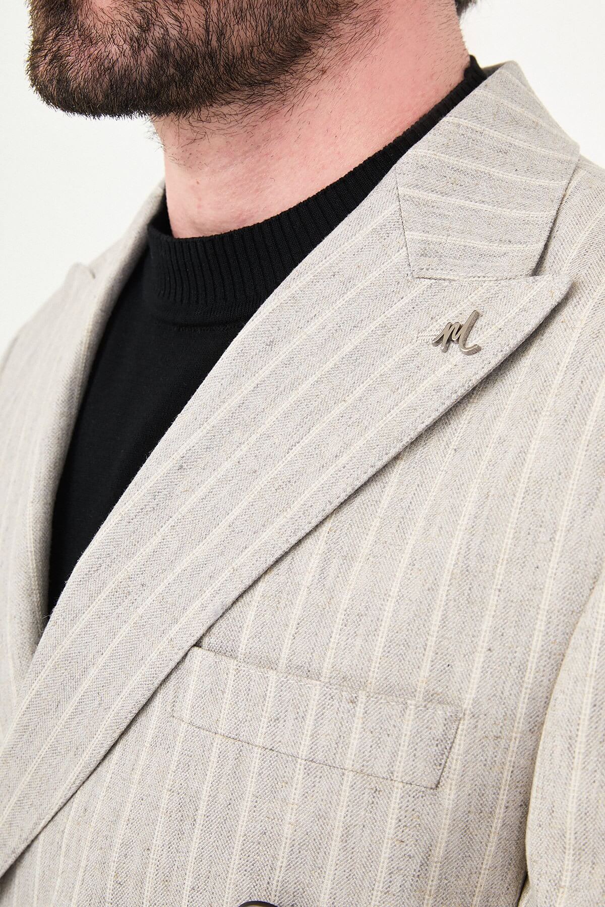Light Beige Pinstripe Double-Breasted Suit worn by male model, slim fit, summer formalwear, front view, styled with black turtleneck and dress shoes.