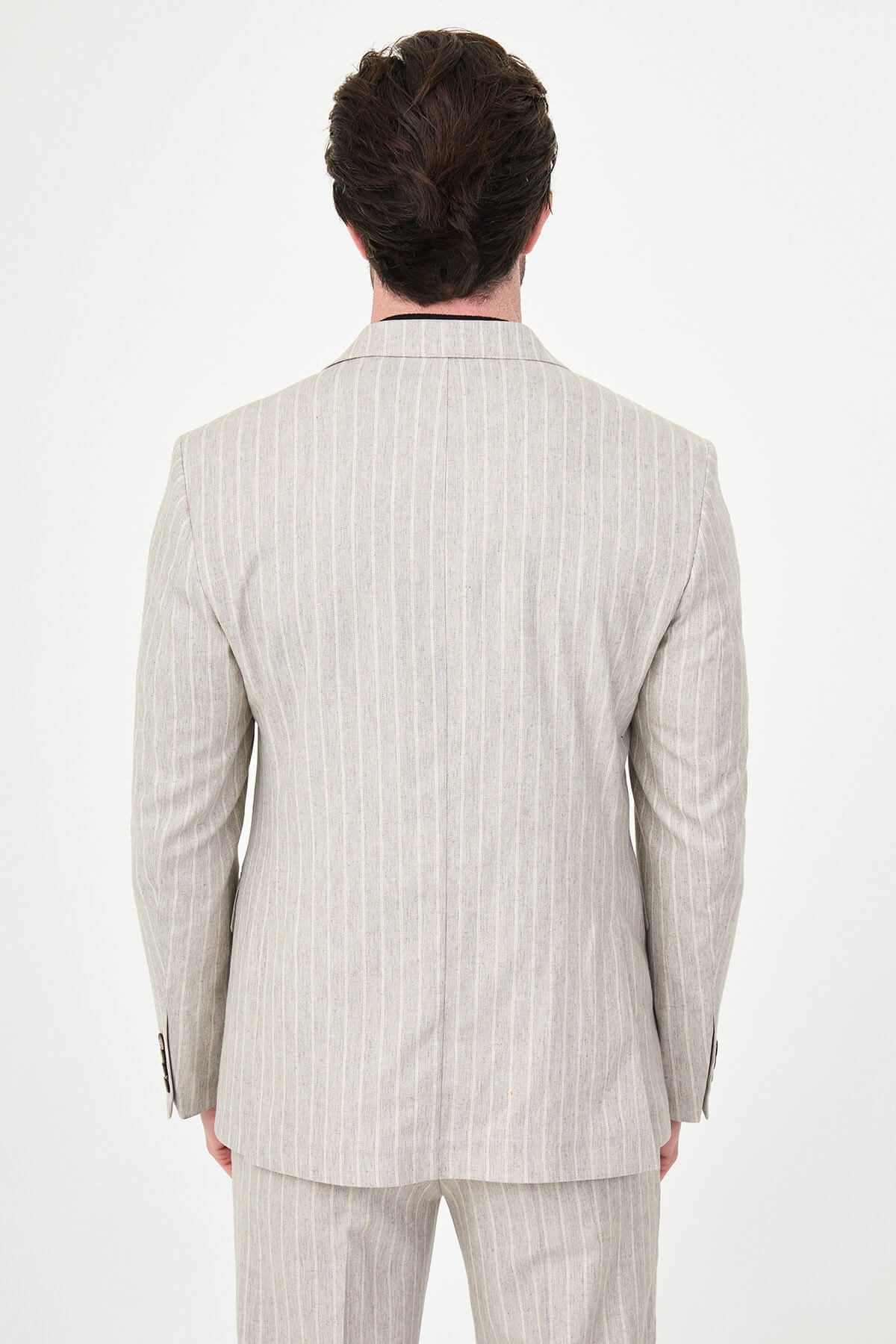 Light Beige Pinstripe Double-Breasted Suit worn by male model, slim fit, summer formalwear, front view, styled with black turtleneck and dress shoes.
