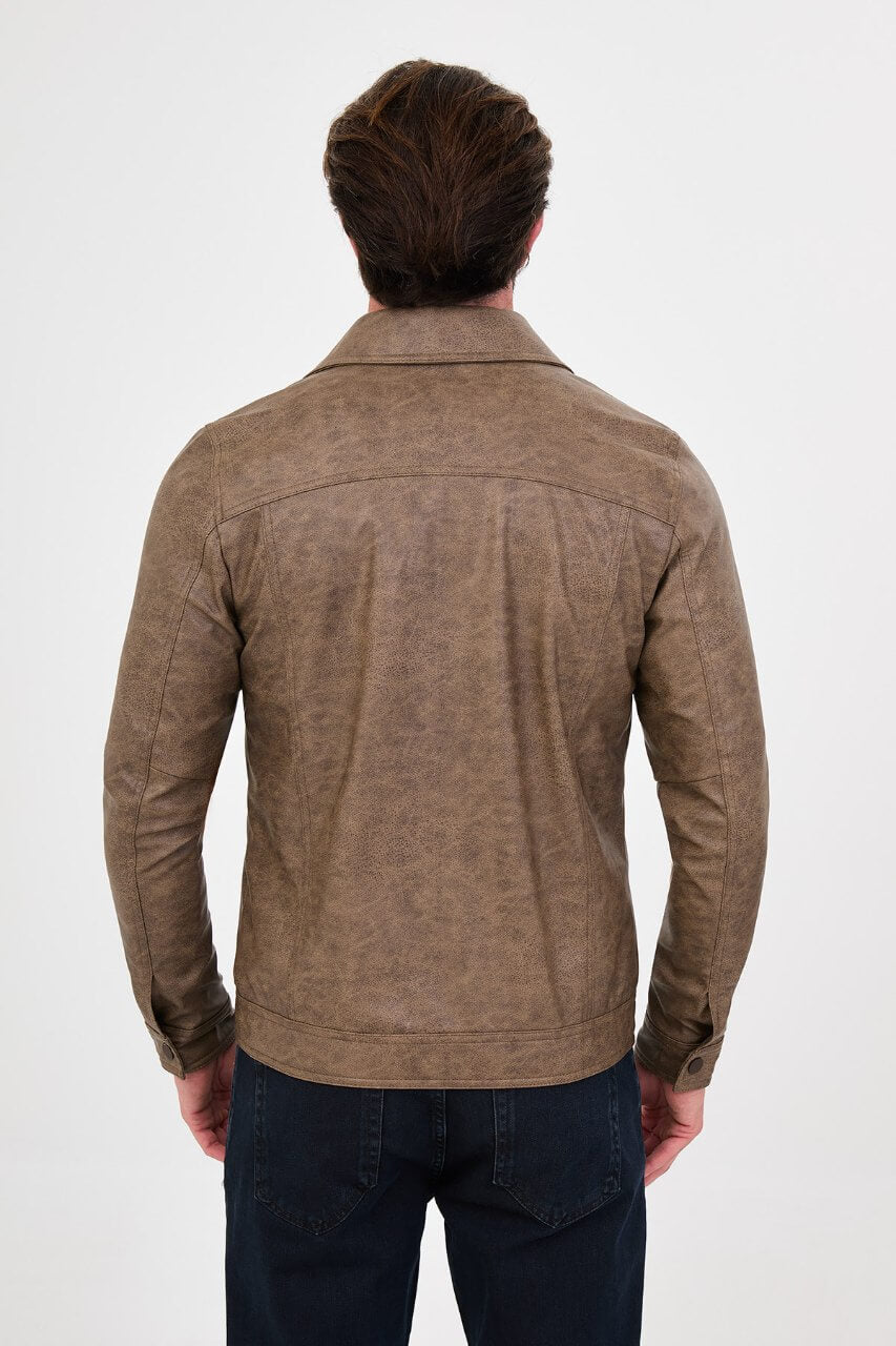 Men's mink-brown PU leather jacket styled with dark jeans, a beige sweater and brown boots.