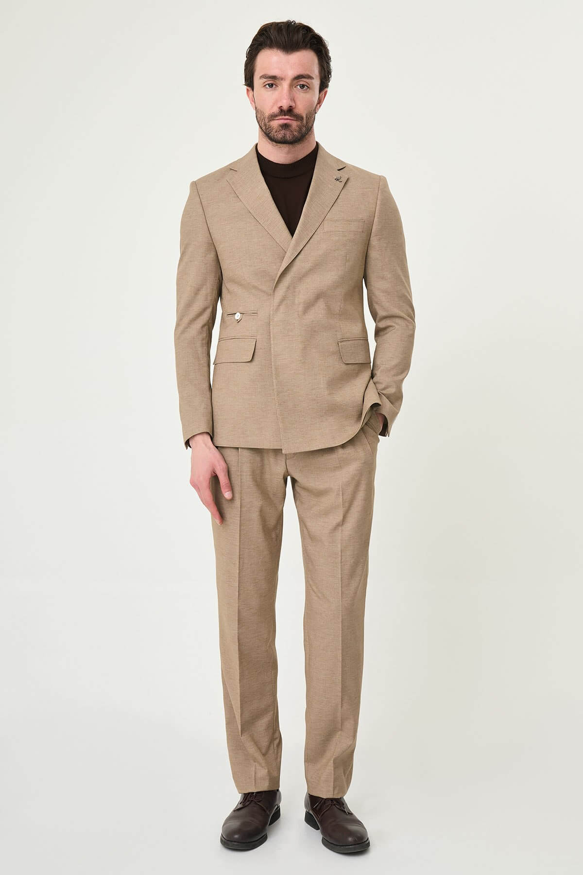 Mink slim fit pinstripe double-breasted summer suit, model wearing a fitted mink-colored suit with pinstripes, paired with dark dress shoes.