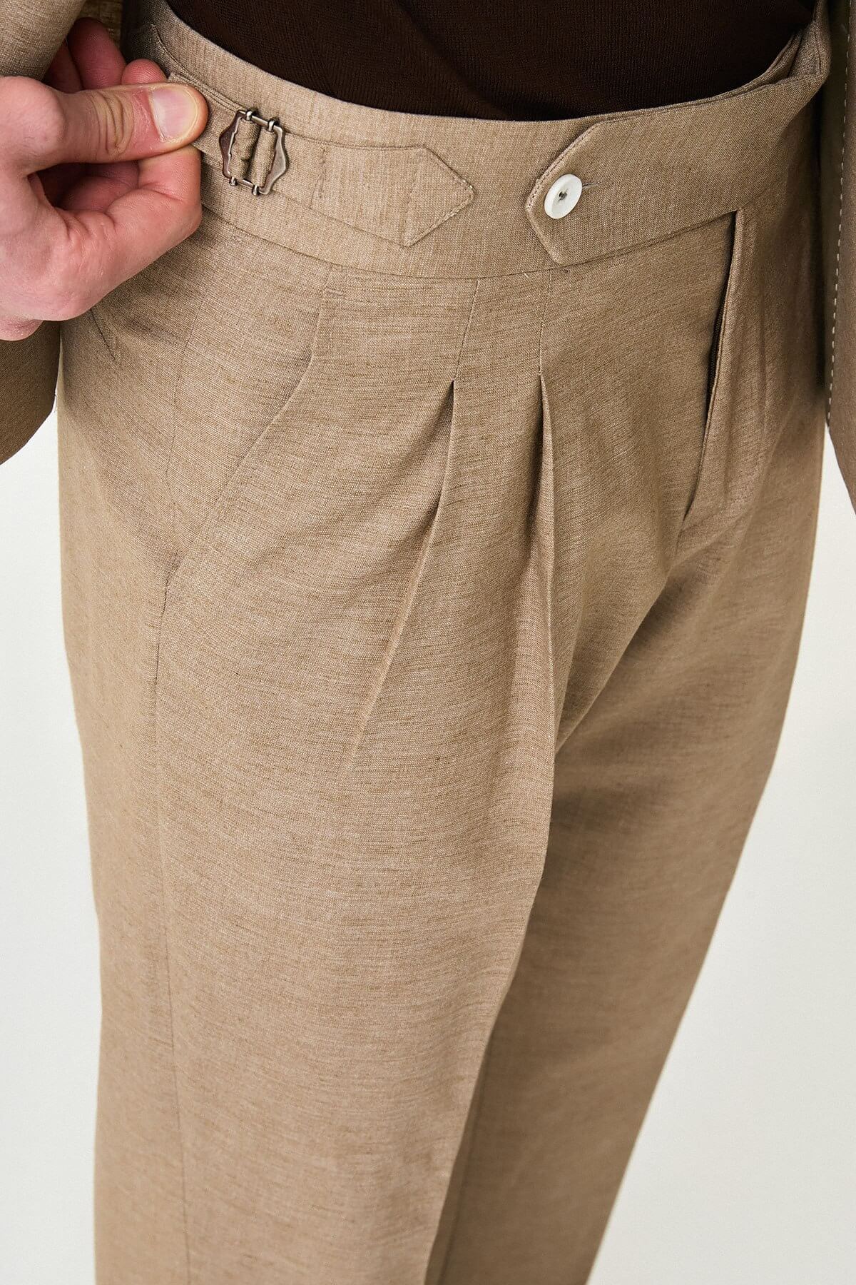 Mink slim fit pinstripe double-breasted summer suit, model wearing a fitted mink-colored suit with pinstripes, paired with dark dress shoes.