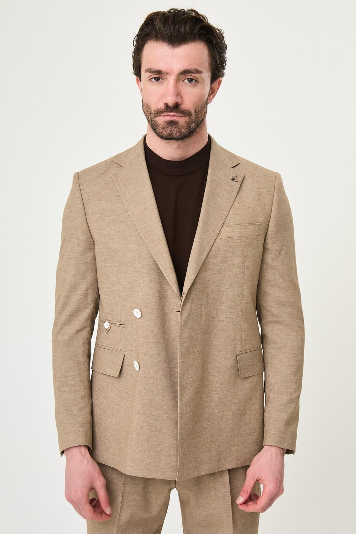 Mink slim fit pinstripe double-breasted summer suit, model wearing a fitted mink-colored suit with pinstripes, paired with dark dress shoes.