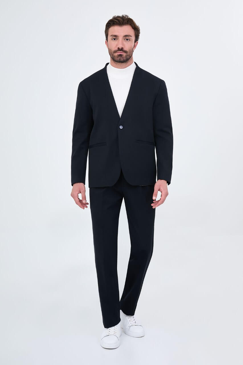 Men's navy blue slim-fit two-piece suit with a modern collarless V-neck jacket and matching trousers.