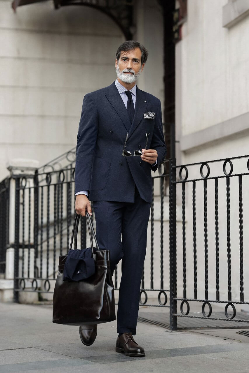 HolloMen men's navy blue double-breasted suit featuring notch lapels, a six-button jacket, and lower patch pockets.