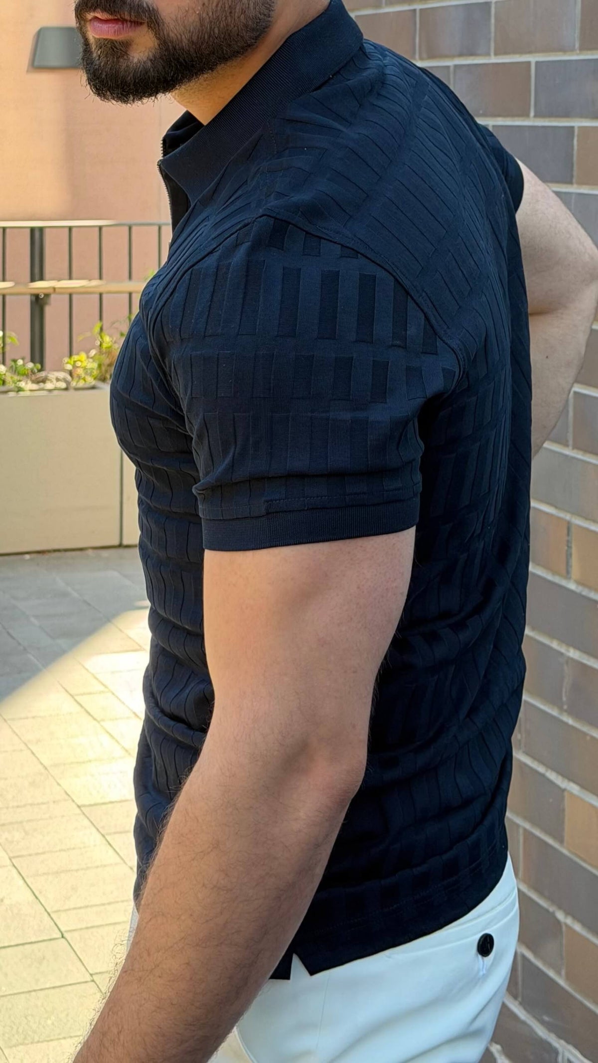 Men’s navy blue half zip polo shirt with textured cotton design for smart casual outfits