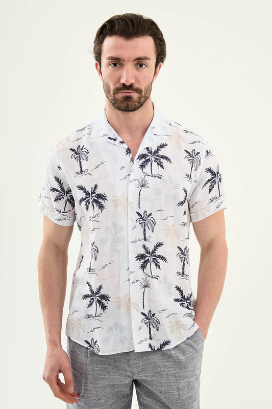 Men’s navy blue palm tree print short sleeve shirt in a lightweight Tencel and linen blend with a relaxed summer resort style.