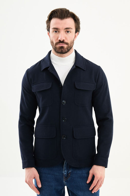 Men’s navy blue wool blend utility jacket with button-up front and four pockets, regular fit smart casual layering jacket styled with blue jeans and white turtleneck sweater