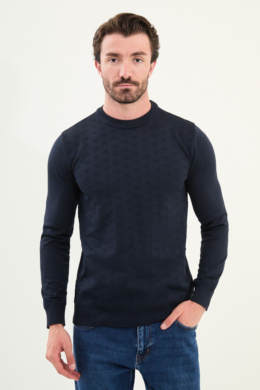 Men’s slim-fit navy blue crew-neck sweater with geometric ‘T’ textured knit front panel, cotton-viscose-elastane blend, styled with blue denim for winter smart-casual.