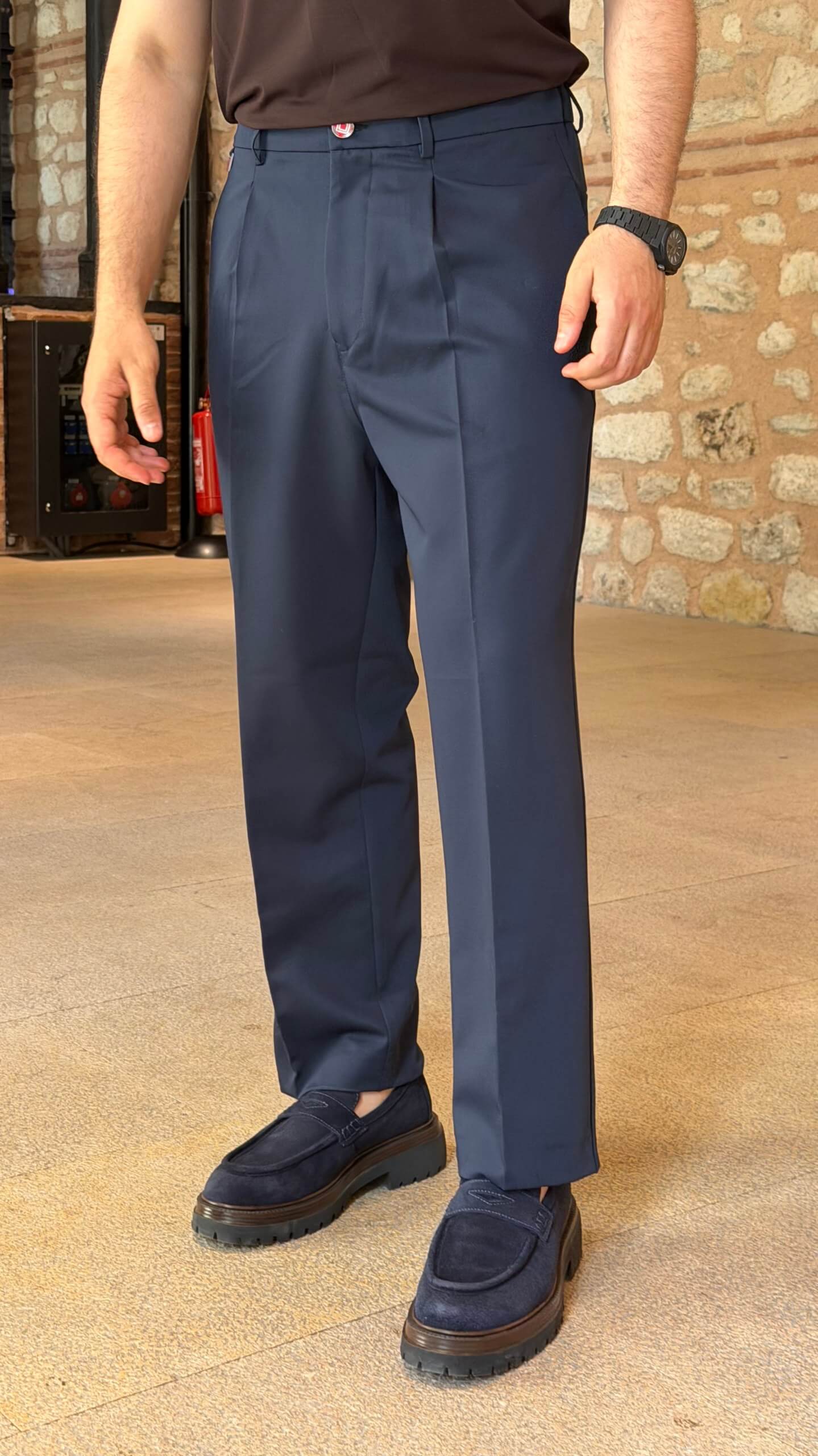 Men's navy blue single pleated trousers with tailored straight leg fit