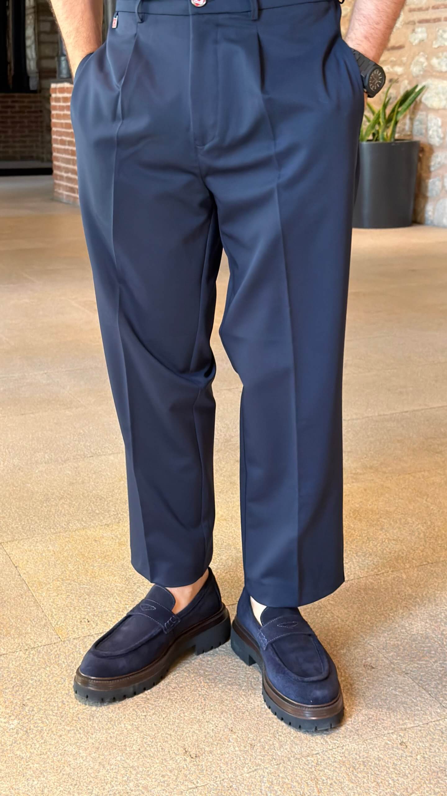 Men's navy blue single pleated trousers with tailored straight leg fit