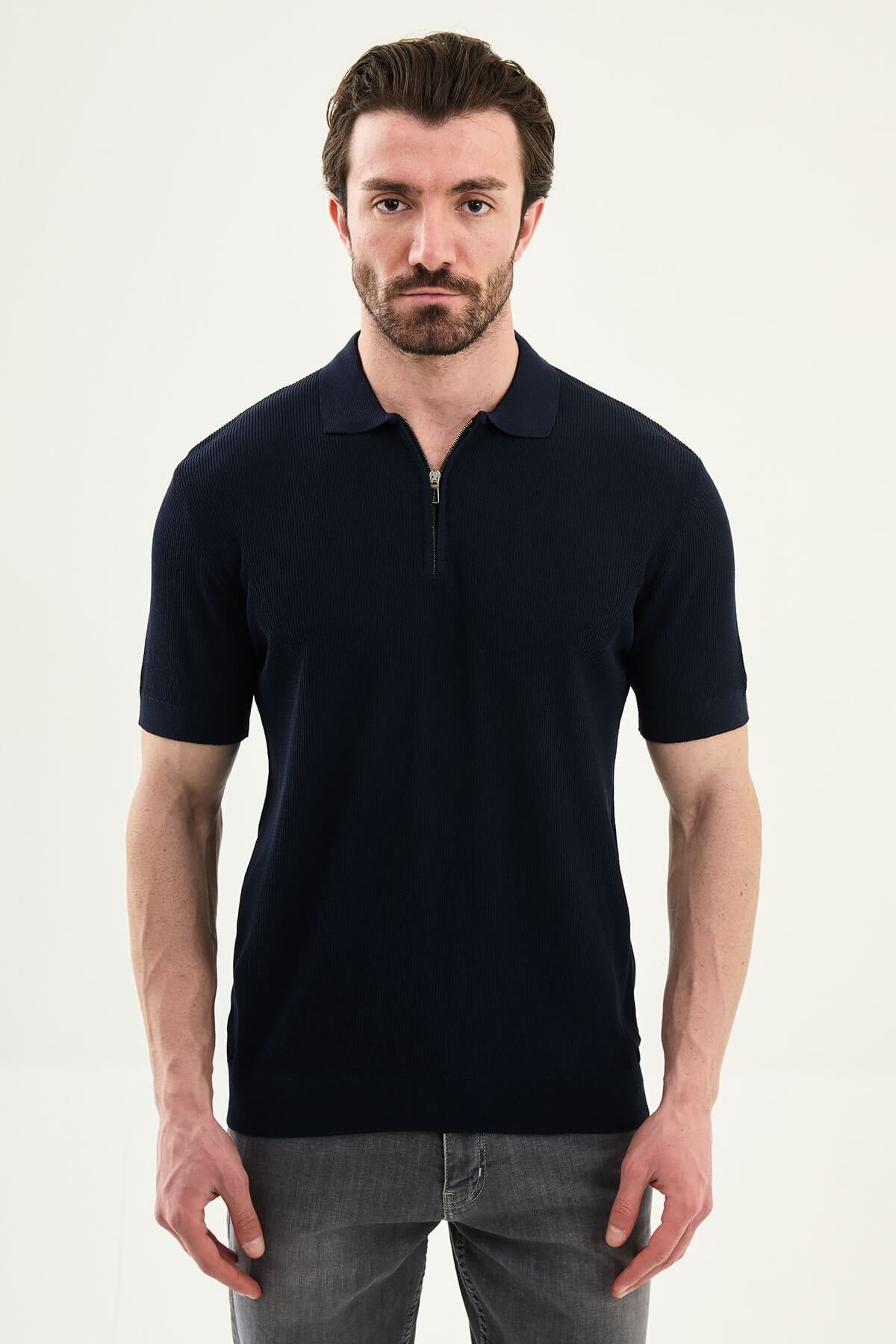 Men’s navy blue slim-fit knit polo shirt with classic collar, short sleeves, and textured knit finish for summer smart-casual style.