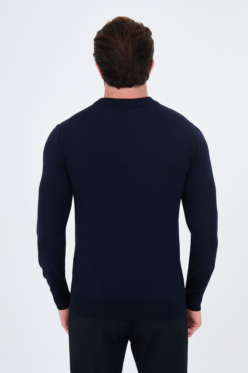 Men's navy blue crew neck sweater with dark brown and ecru geometric colour-block panels.