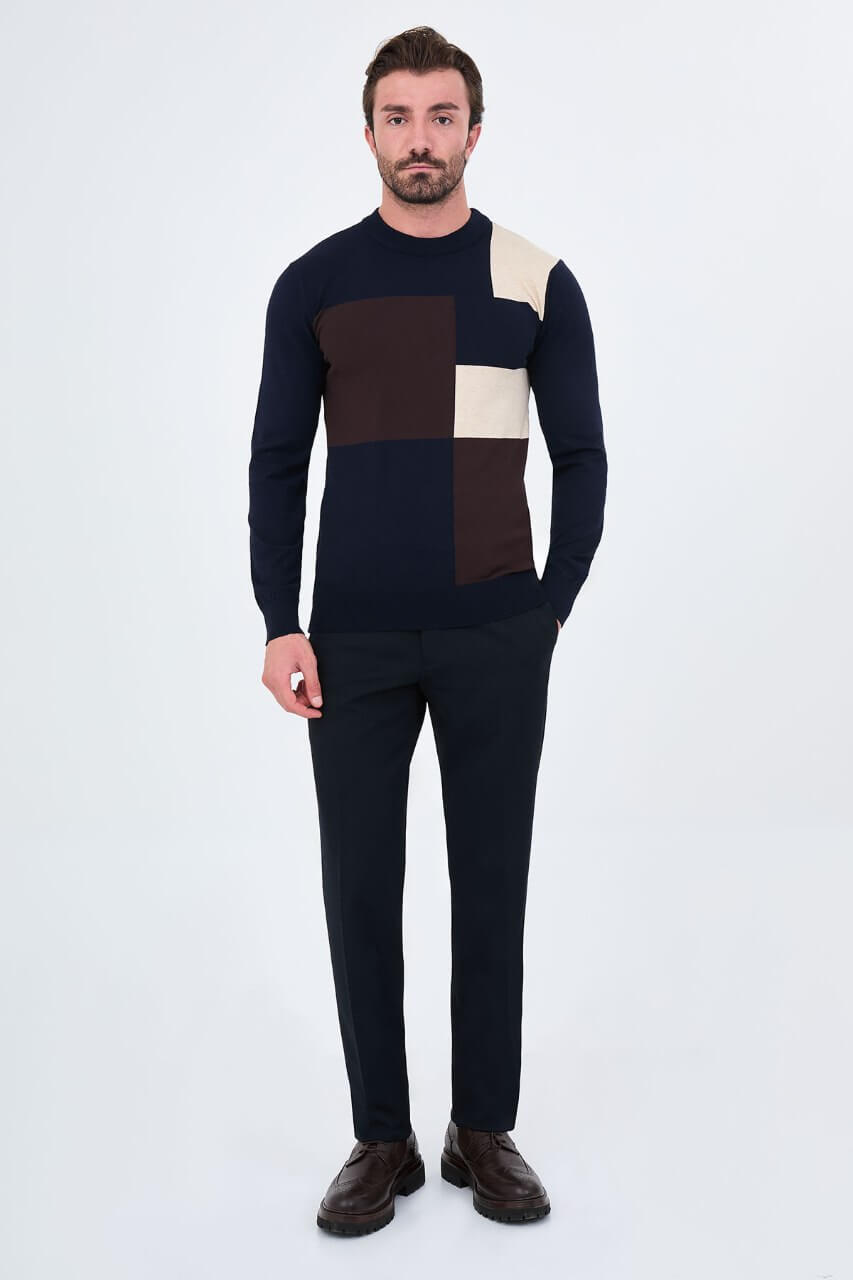 Men's navy blue crew neck sweater with dark brown and ecru geometric colour-block panels.