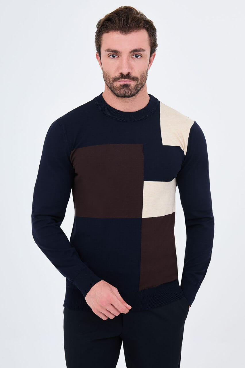 Men's navy blue crew neck sweater with dark brown and ecru geometric colour-block panels.