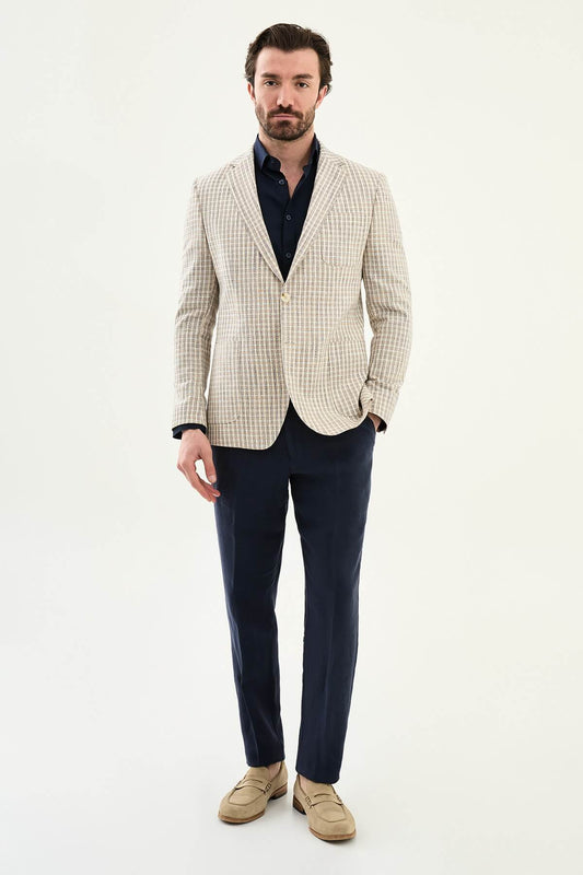 Men’s navy blue slim fit cotton linen blazer with a lightweight textured pattern, styled for elegant smart casual and summer occasions.