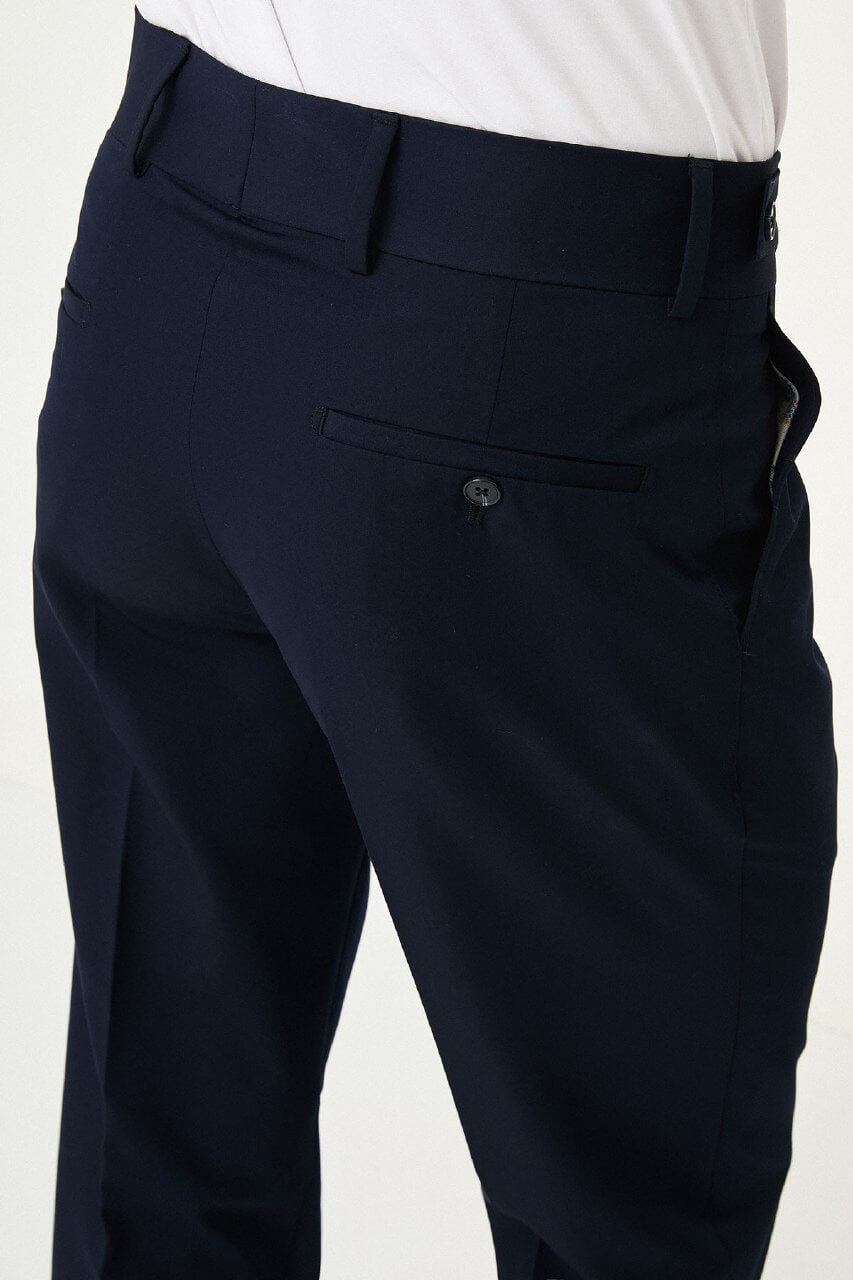 Navy Blue slim-fit straight-leg pleated trousers for men, styled with dark bluw sneakers, ideal for summer business and formal occasions.