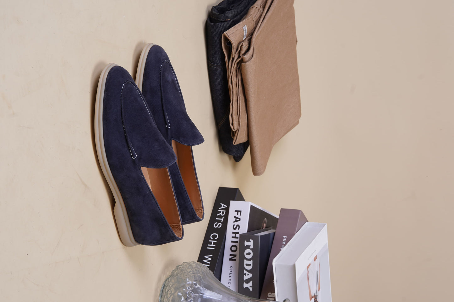Men’s navy blue suede leather casual slip-on loafers with moccasin stitching and lightweight sole.