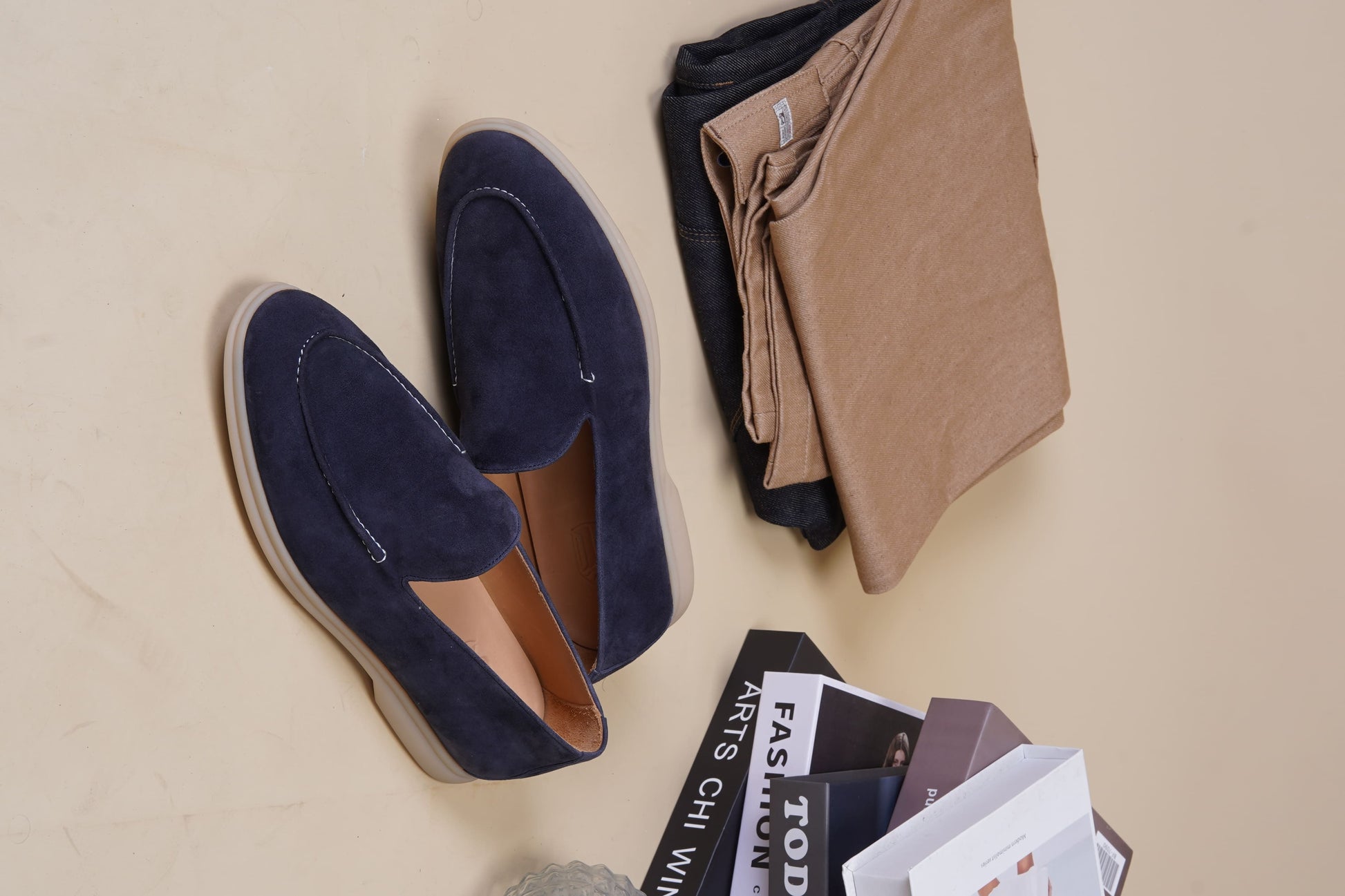 Men’s navy blue suede leather casual slip-on loafers with moccasin stitching and lightweight sole.