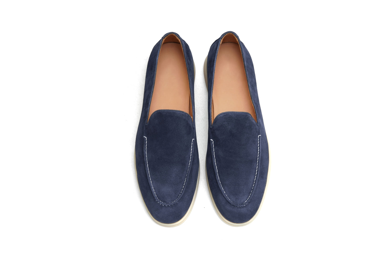 Men’s navy blue suede leather casual slip-on loafers with moccasin stitching and lightweight sole.