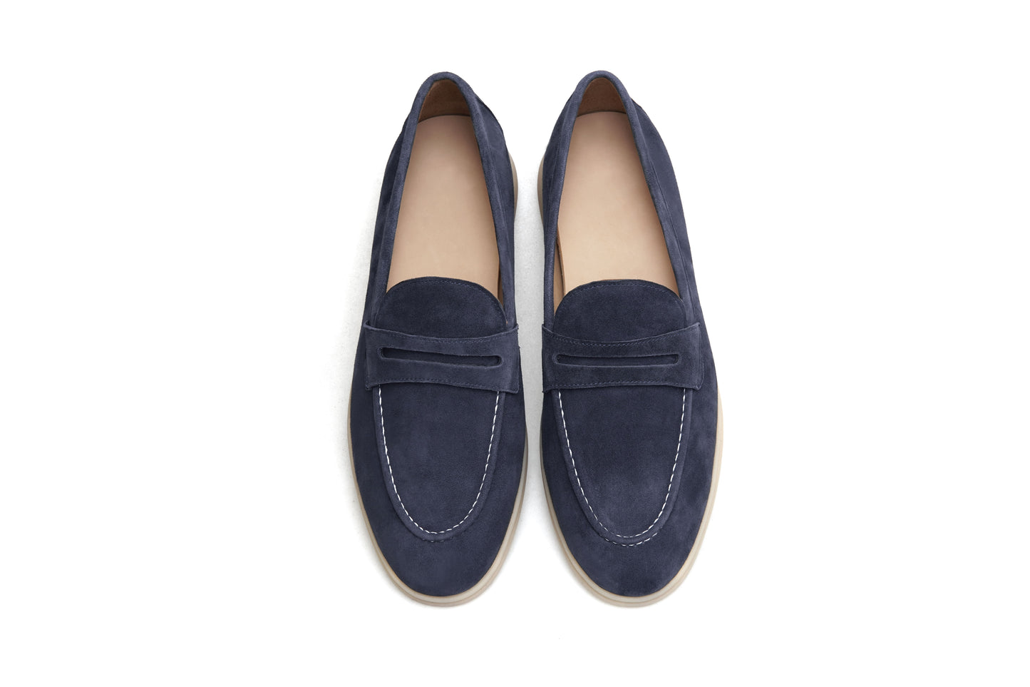Men’s navy blue suede leather penny loafers with classic vamp strap and lightweight sole.