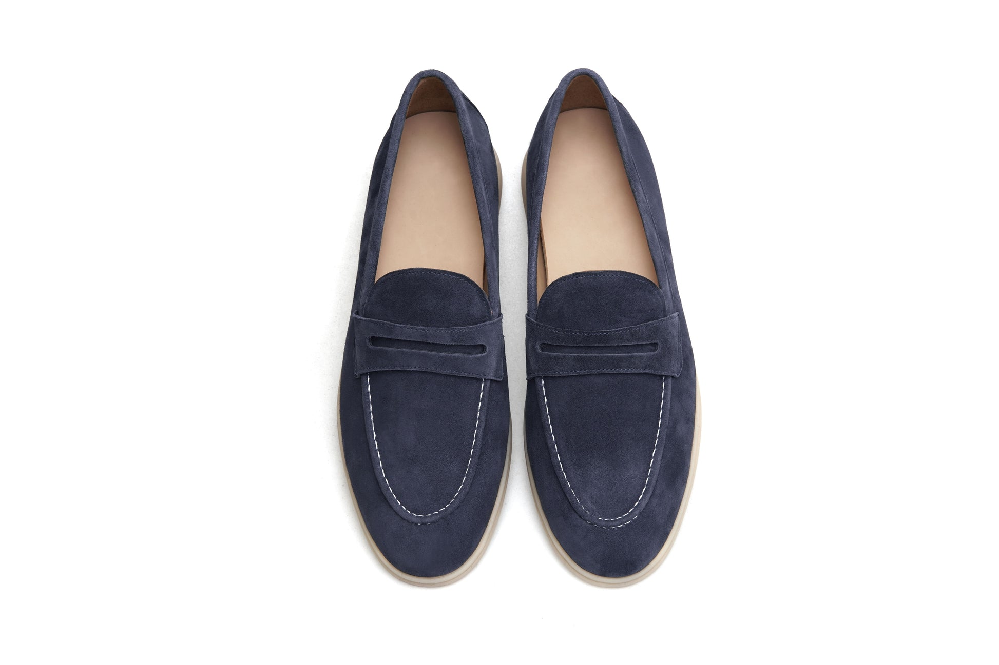 Men’s navy blue suede leather penny loafers with classic vamp strap and lightweight sole.