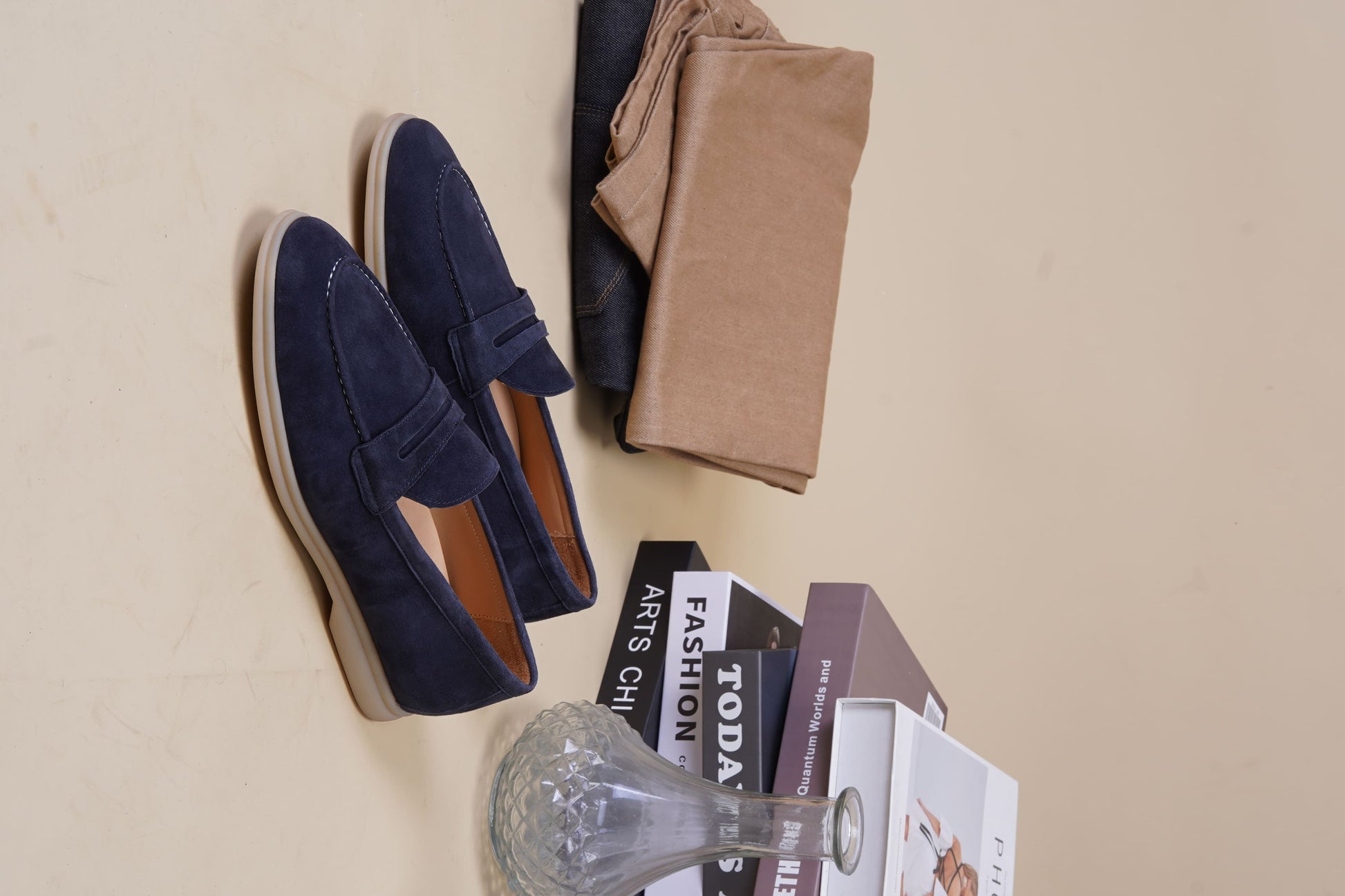 Men’s navy blue suede leather penny loafers with classic vamp strap and lightweight sole.