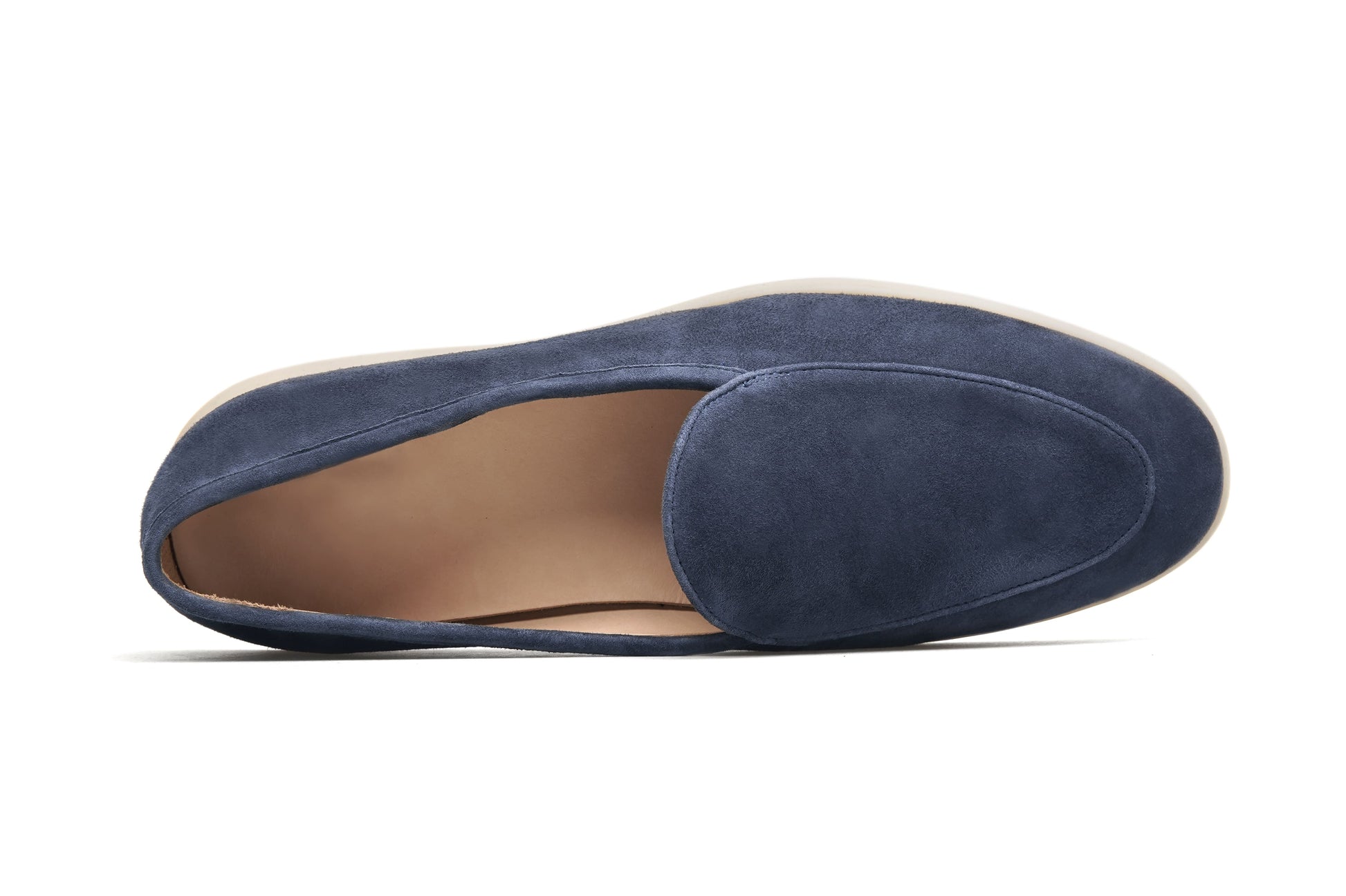 Men’s navy blue suede slip-on loafers featuring a minimalist design and cream sole, styled for elegant summer smart-casual outfits.