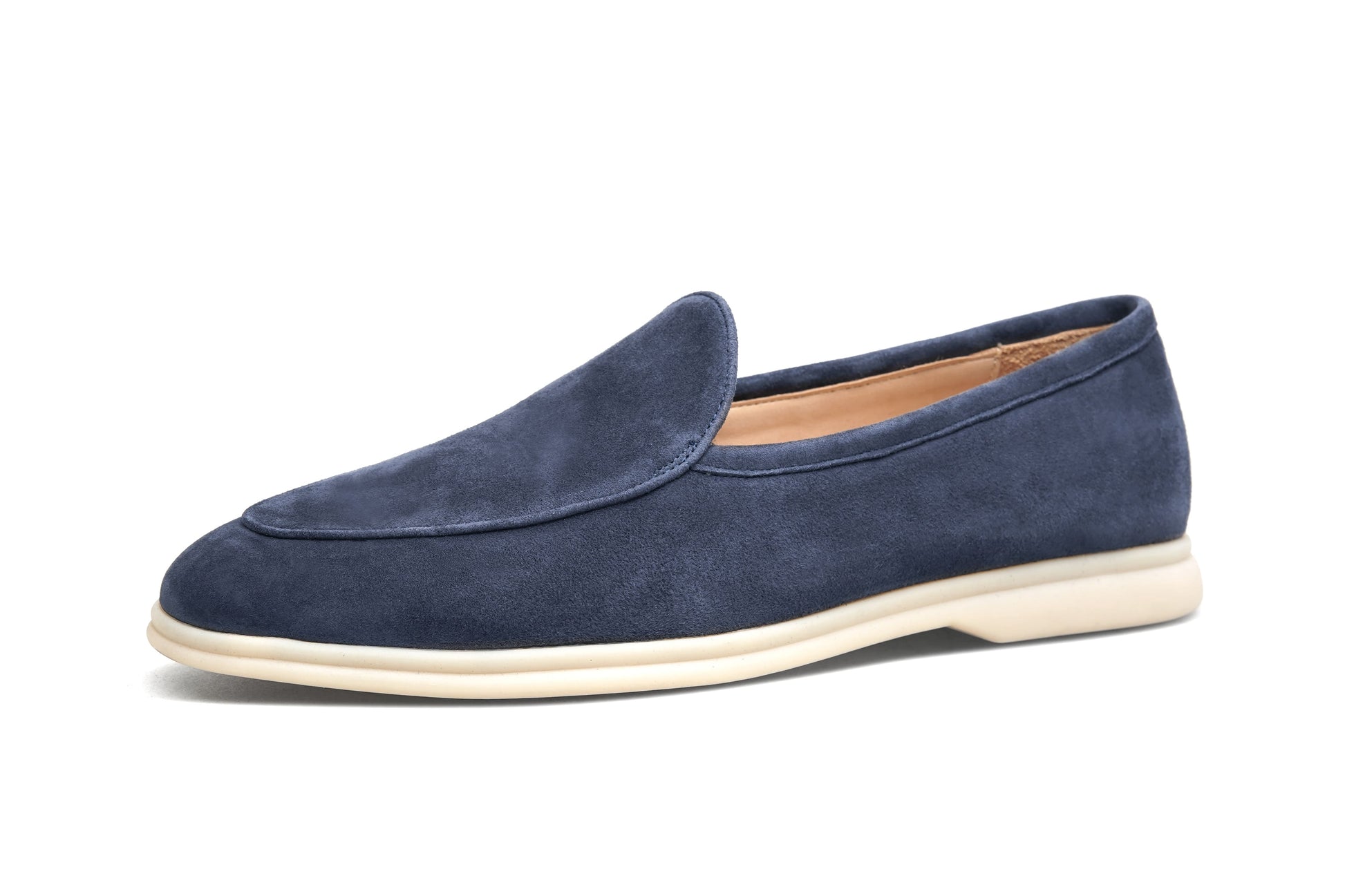 Men’s navy blue suede slip-on loafers featuring a minimalist design and cream sole, styled for elegant summer smart-casual outfits.