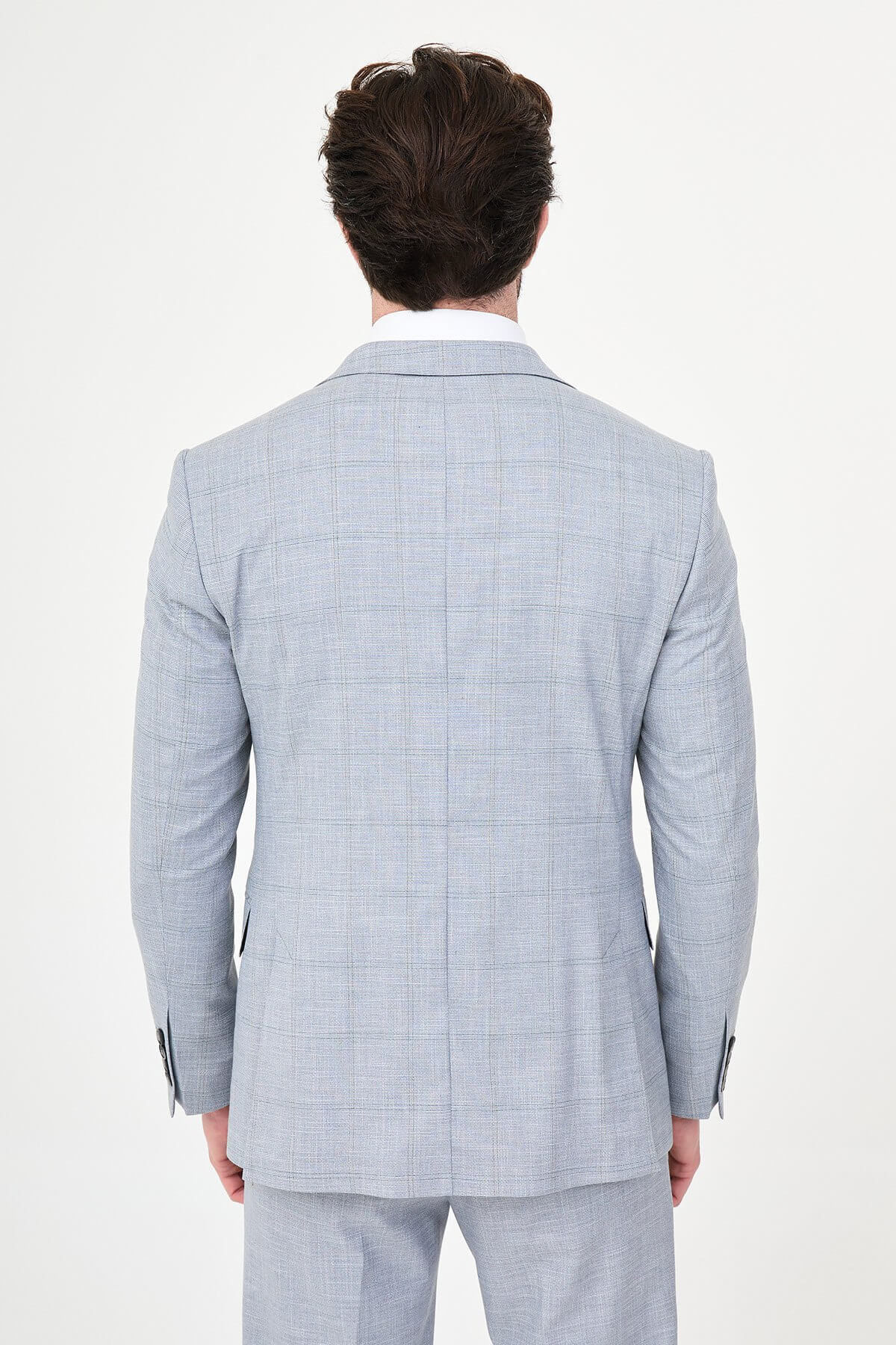a navy blue slim-fit three-piece suit with a subtle windowpane check, matching waistcoat and trousers, white dress shirt, burgundy striped tie, and black leather Derby shoes.