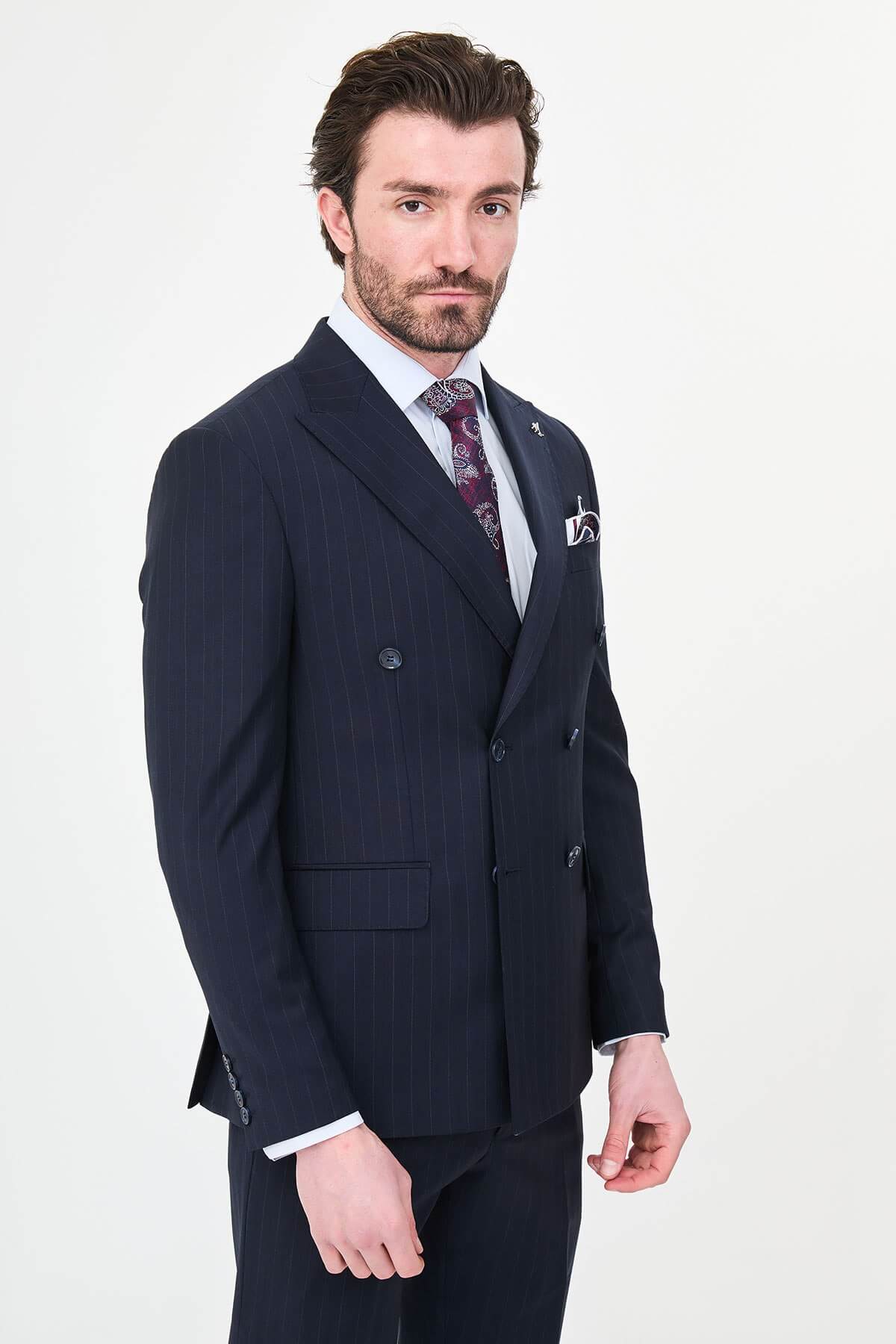 Hollomen Navy Blue Pinstripe Double-Breasted Slim Fit Premium Wool Suit on a male model, styled with a burgundy patterned tie and matching pocket square.