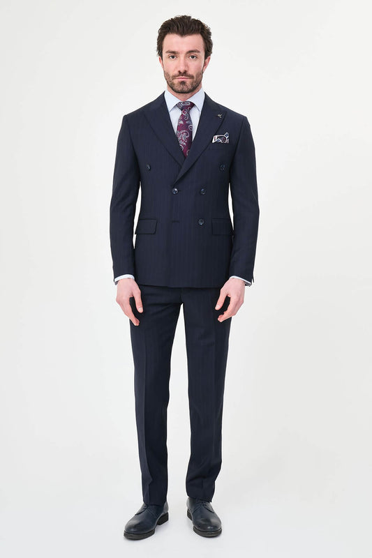Hollomen Navy Blue Pinstripe Double-Breasted Slim Fit Premium Wool Suit on a male model, styled with a burgundy patterned tie and matching pocket square.